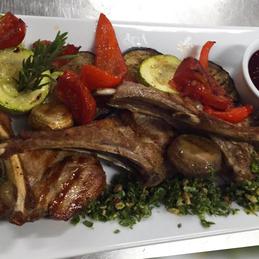 Rack of veal (marinated with walnuts and cilantro) with grilled vegetables and berry sauce