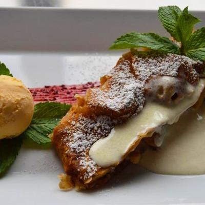 Apple strudel with scoop of ice cream